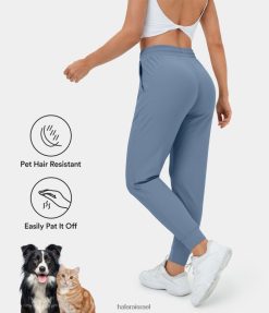 Halara נשים patitoff flow שיער חיות מחמד עמיד בכיס צד עם שרוך מותן גבוה 7/8 ג'וגרים XX0PF14 בגדים פעילים כחול אוקיינוס ​​עמוק